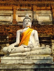Stone statue of a Buddha at old temple