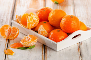 Fresh Tangerines  on  a wooden background