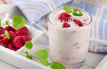 Raspberry yogurt with fresh  mint leaves