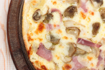 Delicious pizza ham with mushroom no wood
