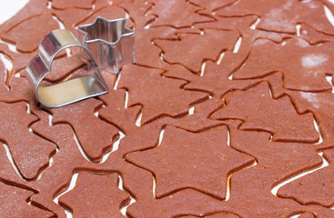 Gingerbread dough for Christmas cookies and cookie cutters
