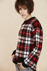 Portrait of mid adult woman in checked top.