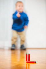 Boy and firecrackers, focus on firecrackers