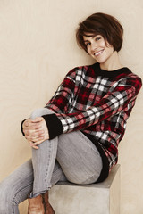 Fototapeta premium Portrait of mid adult woman in checked top.