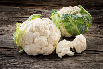 Organic cauliflower on wooden background