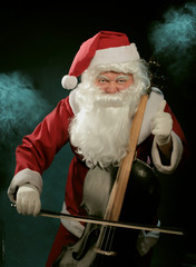 Santa Cklaus playing cello over dark background © evasilchenko