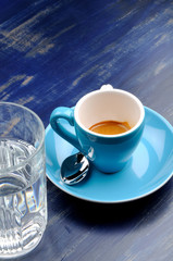 cup espresso with glass of water