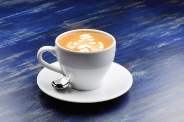 latte on a blue wood table