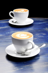 latte on a blue wood table