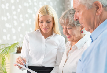 Elderly couple purchasing life insurance