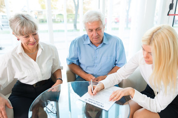 Elderly couple purchasing life insurance