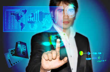 Business man with touch screen and business statistics