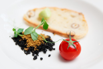 Gourmet dish of ground olives, bread and tomato