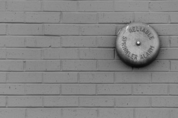 Black and White of Old Weathered Fire Alarm
