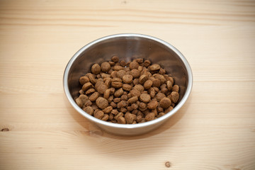 bowl with balls of dry pet foods