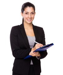 Fototapeta na wymiar Businesswoman write on clipboard