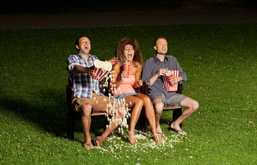 Fototapeta premium three friends watching a movie
