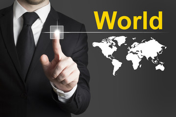 businessman pushing button world worldmap