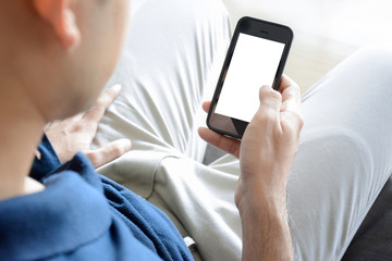 A man using smartphone while sitting