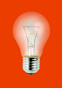 Light bulb isolated on red background.