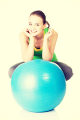 Healthy lifestyle woman with pilates exercise ball.