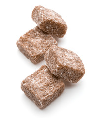 Brown lump cane sugar cube isolated on white background cutout