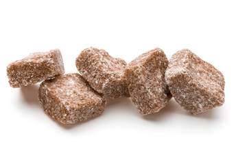 Brown lump cane sugar cube isolated on white background cutout