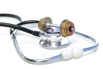 MEDICAL EXPENSES - A stethoscope & a coin-weight-lift on top.