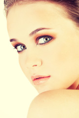Fototapeta premium Attractive young woman's face. Closeup.