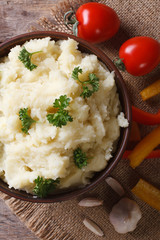 mashed potatoes with parsley closeup. vertical top view