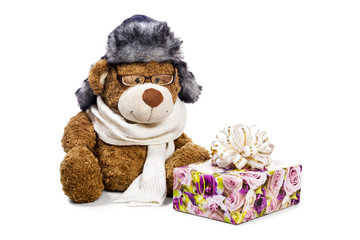 Teddy bear near gift box