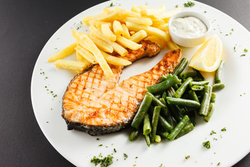 grilled salmon steakk with french fries