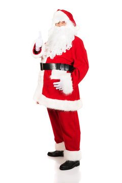 Full length Santa Claus gesturing ok sign