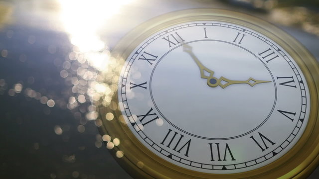 Clock ticking against sun on the sea