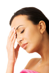 Portrait of stressed nude woman with eyes closed