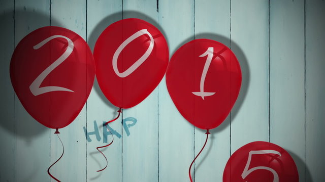 2015 balloons against wooden planks