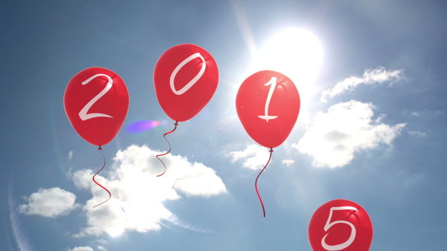 2015 balloons against blue sky