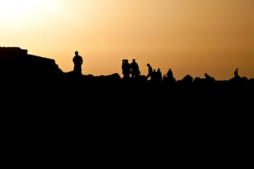 Fototapeta na wymiar People watch sunset in Asilah
