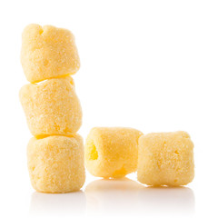 Crunchy corn snacks isolated on white.