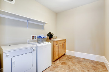 Fototapeta na wymiar Laundry room with white appliances