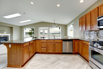 Luxury kitchen room with bright brown cabinets