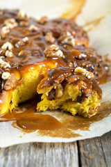 Colorful pumpkin bun with caramel.