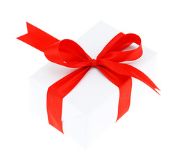 White gift box with red ribbon bow, isolated on white