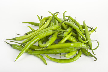 Green chillies on white