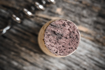 Single Wine Cork on Rustic Wood Background