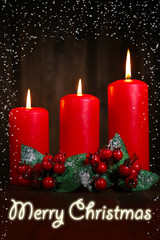 Burning candles on wooden background