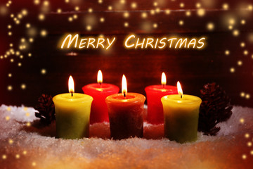 Burning candles on wooden background