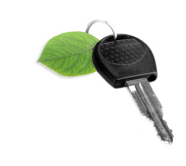 Car key with green leaf trinket isolated on white