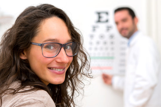 Young attractive woman doing optician test