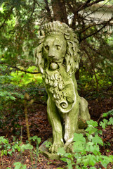 old Lion Statue in a Garden